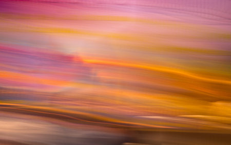 a motion blurred image of stage colorful backdrop with bright light 