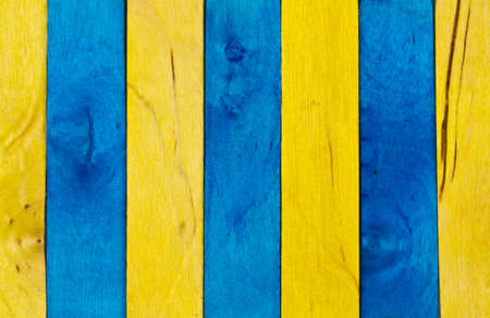 Vertical arrangement of blue and yellow wood in landscape orientation IIの写真素材