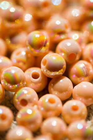 close up of beige-colored beads in portrait orientationの写真素材