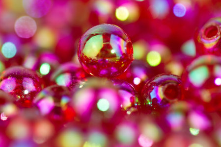 red bead in close up view with bokeh back and foregroundの写真素材