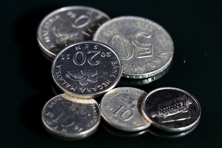 coins on black mirrorの写真素材