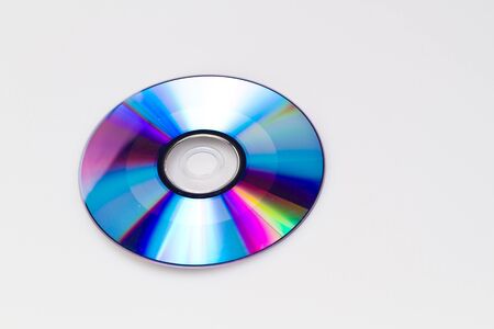 Blank dvd on white background with its reflective blue surface upwardの写真素材