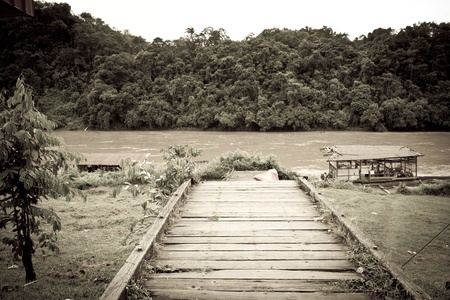 Wooden abandoned dock near a riverの写真素材