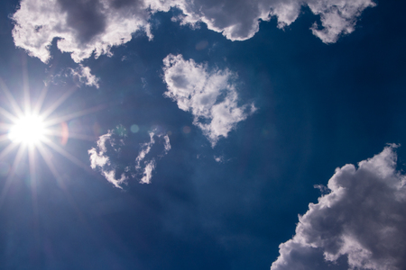 Tropical blue sky with sun and clouds in the afternoonの写真素材