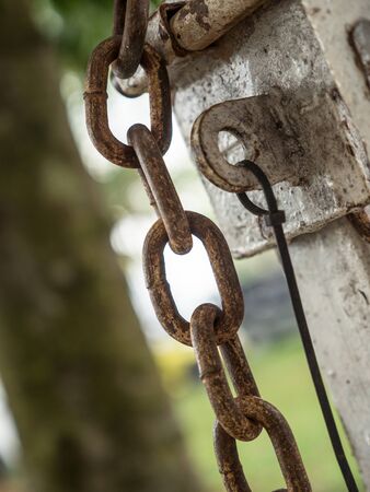 rusty chain and metal lock on the fence gateの写真素材