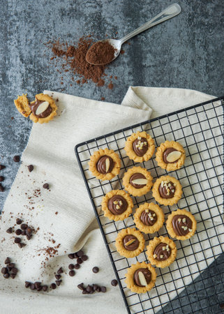 Chocolate tart biscuits with sliced almond