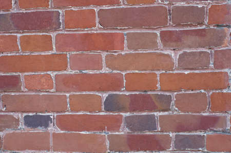 Wall from old brown bricks, a background.の写真素材