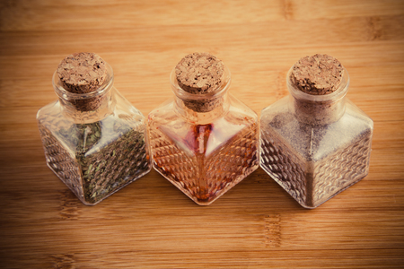 jars of spices on a wooden backgroundの写真素材