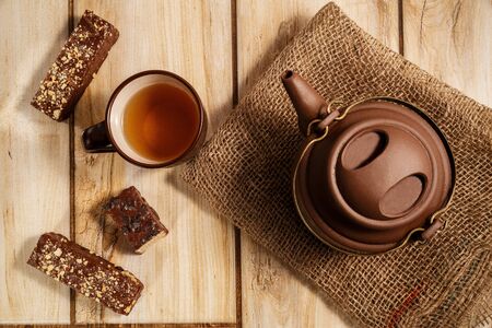 chocolate waffles and tea on wooden background . the view from the topの写真素材