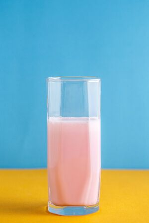 strawberry milkshake on a colored backgroundの写真素材