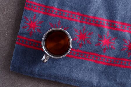 tea in a vintage mug on vintage Christmas backgroundの写真素材