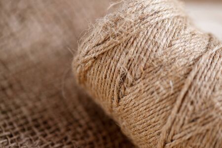 the canvas and the tangle of thread on a wooden backgroundの写真素材