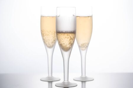 glasses of champagne on a white background. front viewの写真素材