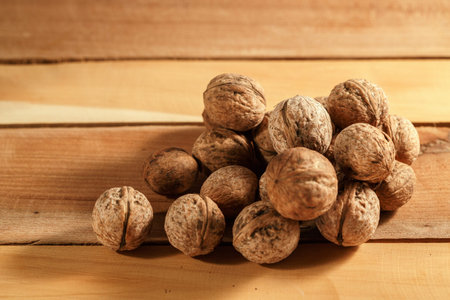 natural fresh walnuts on a beautiful wooden background