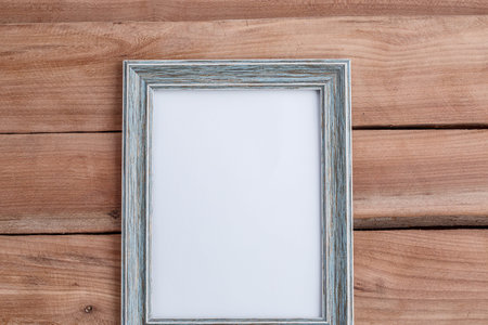 Photo frame on wooden background - vintage style effect picture