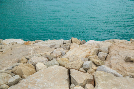 background of stones overlooking the blue sea. selective focus