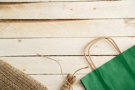 biodegradable environmentally friendly cardboard bag on wooden background