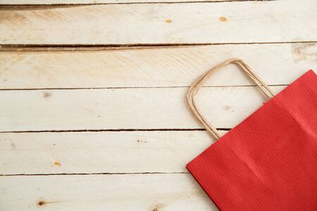 biodegradable environmentally friendly cardboard bag on wooden backgroundの写真素材