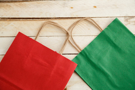 biodegradable environmentally friendly cardboard bag on wooden background