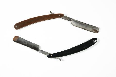 dangerous vintage shaving blade on white isolated backgroundの写真素材