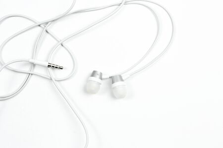 wired headphones on white isolated backgroundの写真素材
