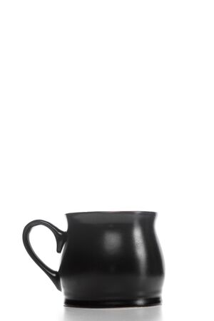 black stylish ceramic beverage Cup on white isolated backgroundの写真素材