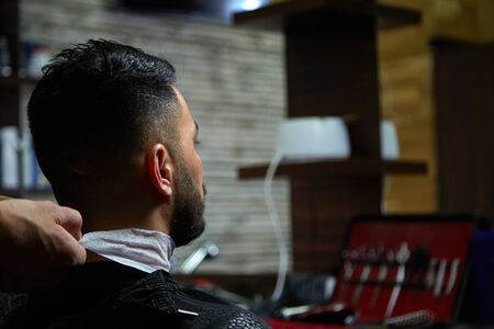 close-up haircut of a dark-haired guy. cinematic photography.の写真素材