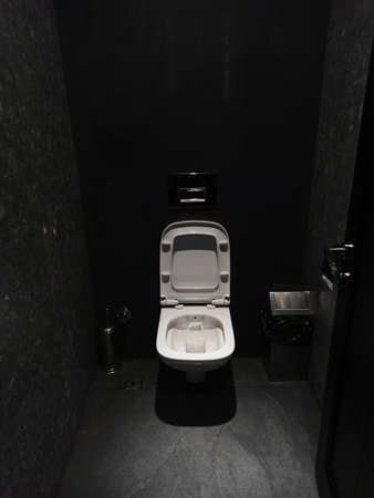 stylish beautiful toilet in a black interior.の写真素材