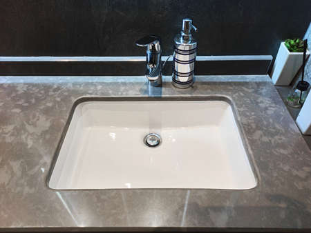 stylish beautiful sink in the interior in a marble countertop.の写真素材