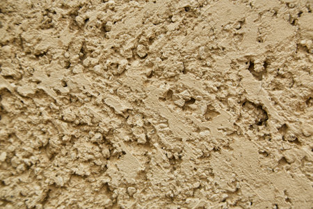 texture of an old cracked sand wall background.