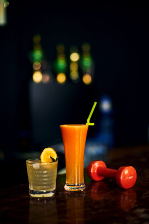 freshly squeezed juice and an invigorating cocktail in the gym. selective focus, low depth of focus....