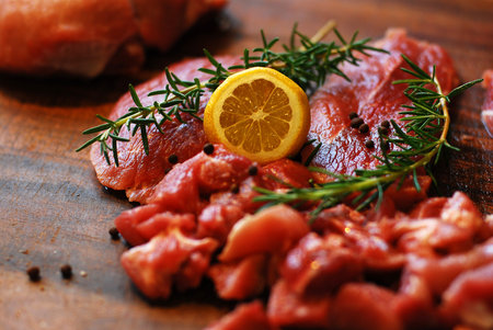 Raw, red, fresh meat pork on a cutting board.