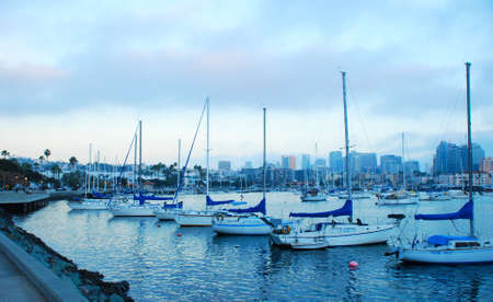 Boats in the cool waters of the Pacific Ocean at the pier in San Diegoの写真素材