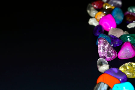 Stones colored crystals on a black background.の写真素材