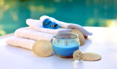 Candle decoration spa salon towel on a white background の写真素材