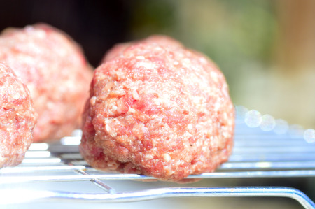 Raw meatballs fresh juicy meat on the table.の写真素材