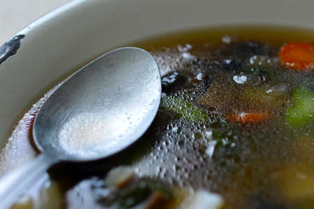 Portobello mushroom soup in a white enamel bowlの写真素材