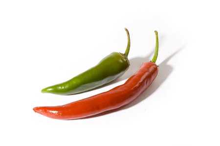 Red and green chilly peppers isolated on white backgroundの写真素材
