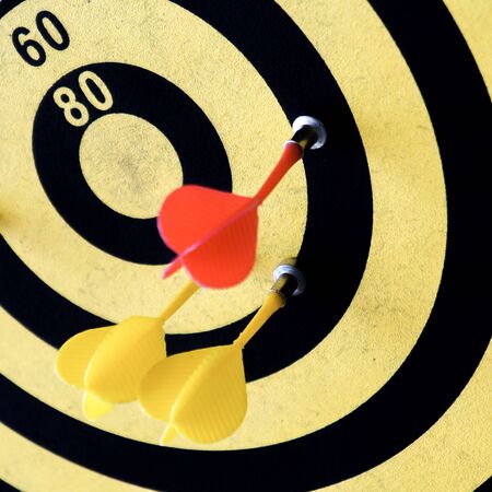 A dart board in yellow and black.の写真素材