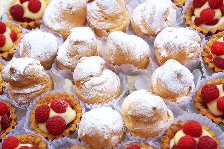 Shus and raspberry cakes on a wedding tableの写真素材
