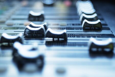 Audio mixer control panel with sliders. Audio mixer in blur.の写真素材