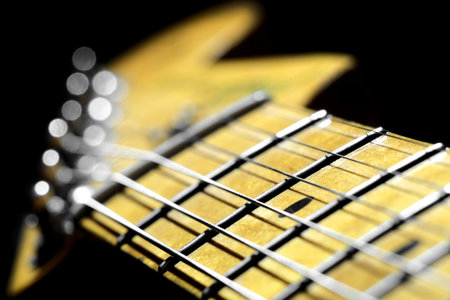 Electric guitar neck with a headstock in blur.