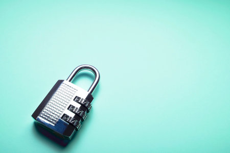 Code padlock on a blue/aqua menthe background with copy-space for text.