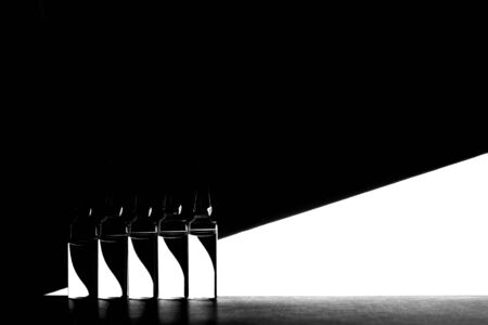 Medicine ampoules on black and white geometric background. High contrast image of ampoules.の写真素材