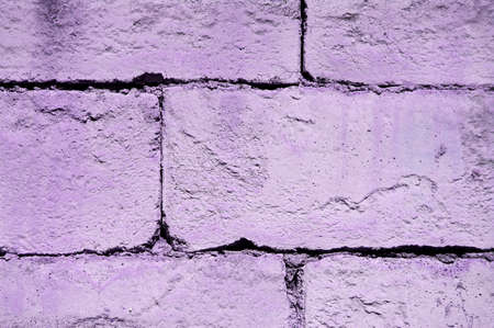 Rough concrete brick layer in purple. Purple wall backgroud.の写真素材