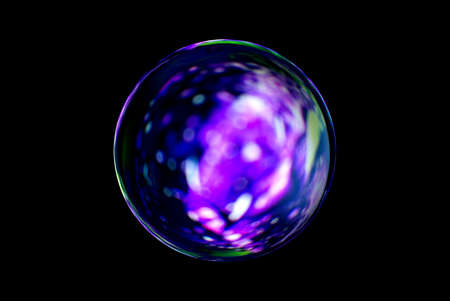 Blurry image of a shiny crystal ball with abstract blurry colorful pattern. Abstract lensball in blur.の写真素材