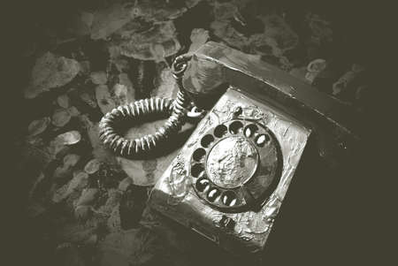 Vintage landline telephone in black and white in blur. Retro dial phone on abstract background.の写真素材