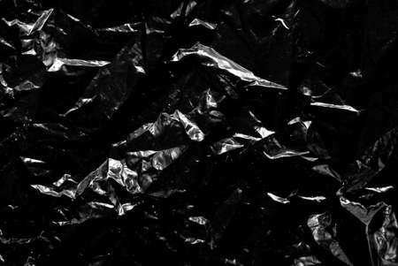 Dark abstract background in a low key. Black abstract background with seamless pattern.の写真素材