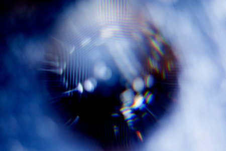 A real photo of an abstract blurry object. An abstract blurry silhouette of a round object.