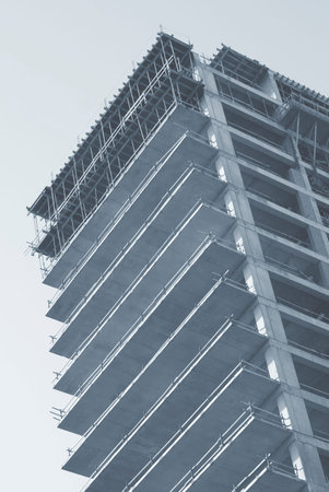 Modern multistory building. Unfinished building in blue.